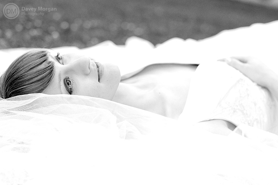 Bride laying on the ground in Columbia, SC | Davey Morgan Photography