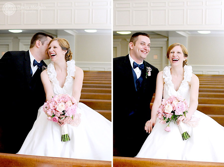 Newlywed couple sitting on pew in church | Davey Morgan Photography