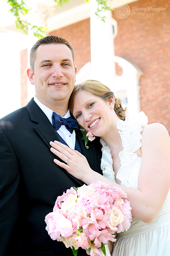 Newlywed couple standing in front of church | Davey Morgan Photography