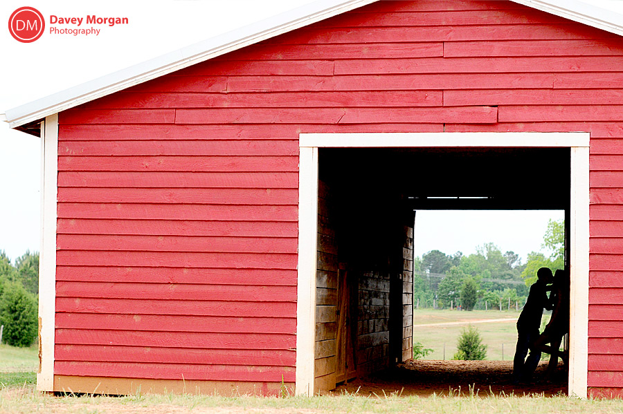 engagement picture silhouette in a red barn  | Davey Morgan Photography