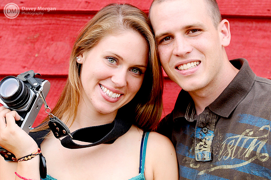 red barn engagement picture of a photographer with a pentax camera  | Davey Morgan Photography