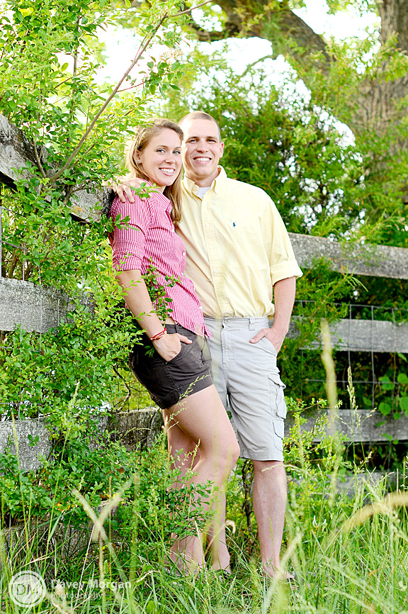 Engagement pictures leaning on a fence | Davey Morgan Photography