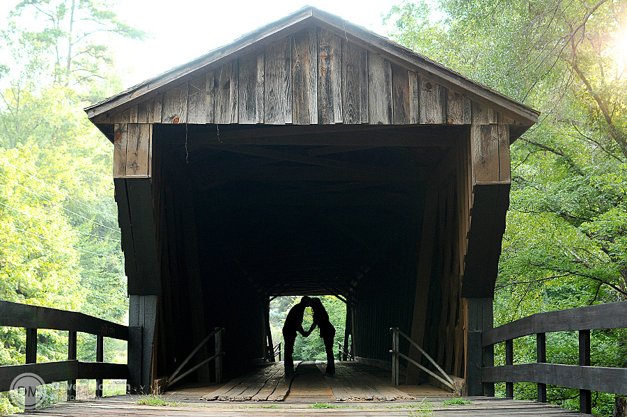 picture of a Couple kissing on a covered bridge | Davey Morgan Photography