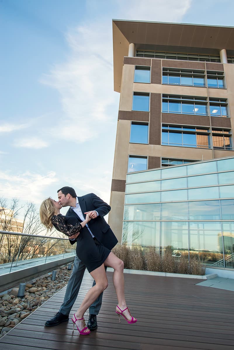 Rooftop engagement pictures in downtown Greenville at the Clemson University building