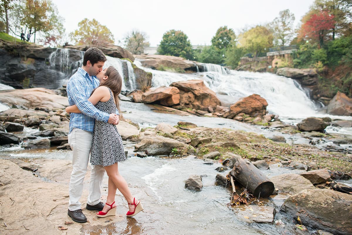 Falls Park waterfall kissing engagement picture in Greenville, SC