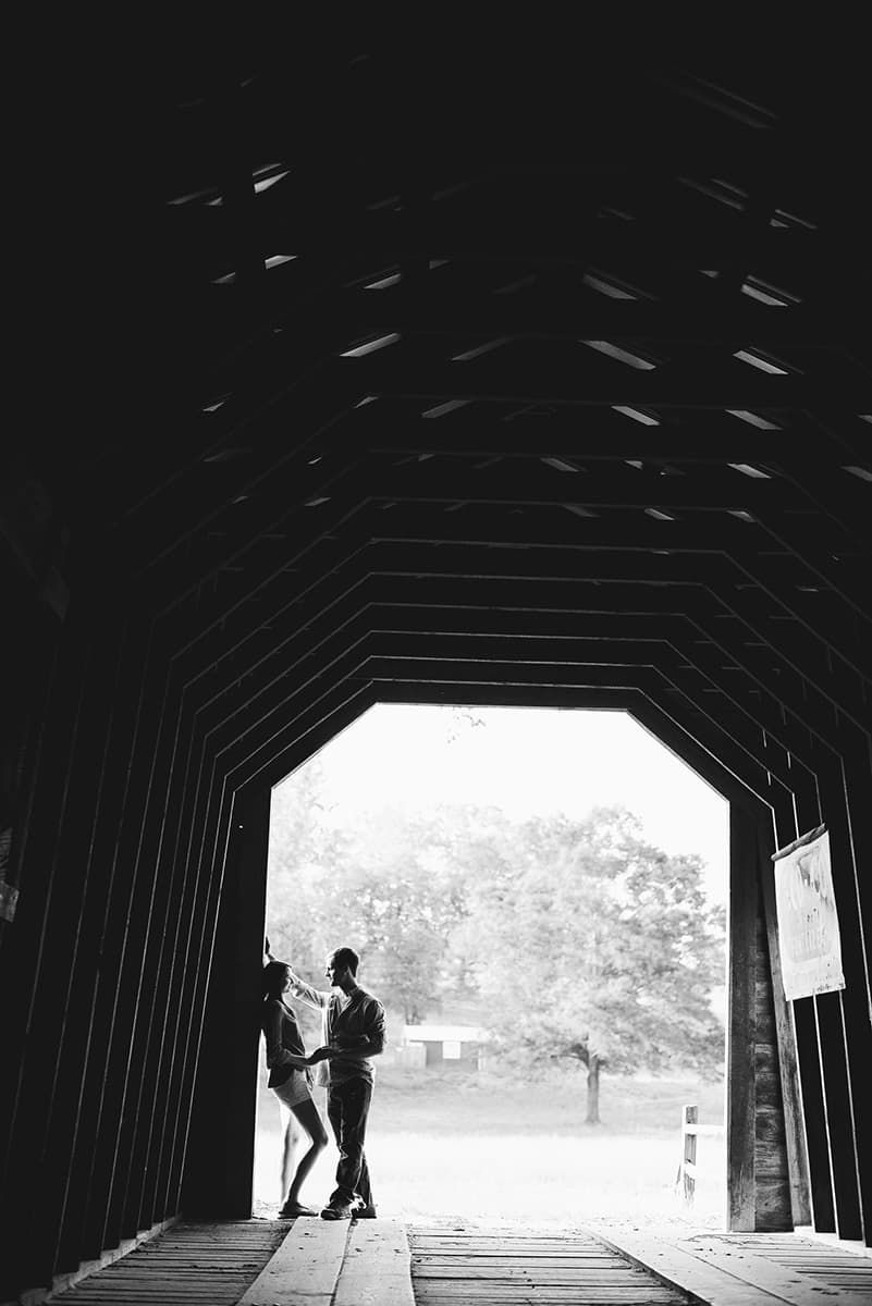 Silhouette engagement pictures on Campbells Covered Bridge in South Carolina