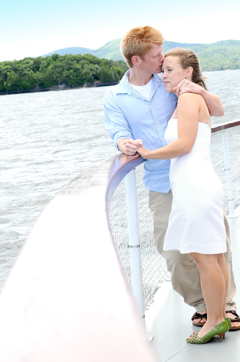 Engagement pictures on a boat at Lake Champlain between New York and Vermont