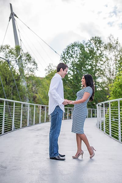 Greenville, SC engagement photographer on Liberty Bridge in Falls Park on the Reedy